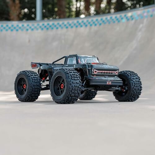 Black monster truck toy on concrete surface