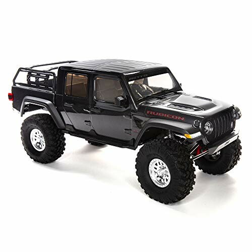 Black toy model of a Jeep with large tires.