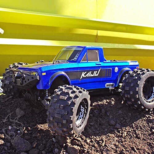 Blue RC monster truck on dirt