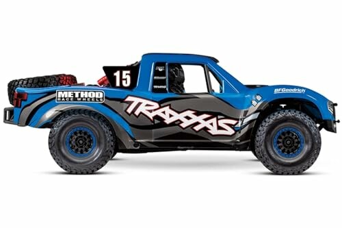 Side view of a blue RC truck with branding decals