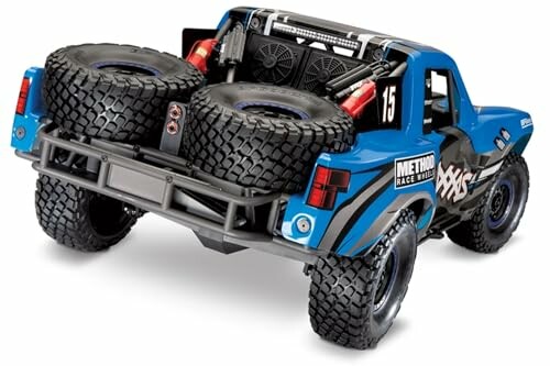 Blue RC truck with spare tires and detailed design