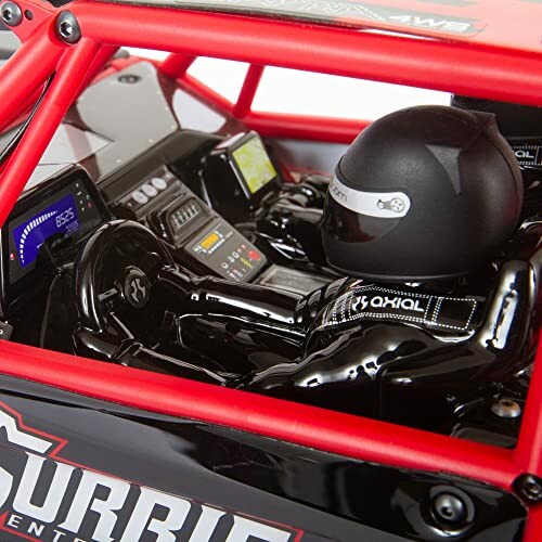 Close-up of RC car interior with dashboard and driver figure.