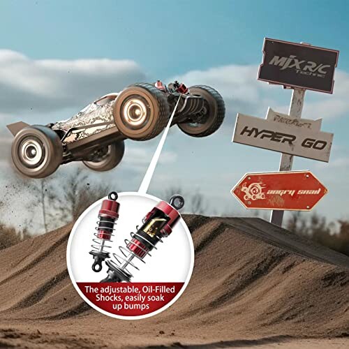 RC car jumping over sandy terrain with shocks insert and signs in background.