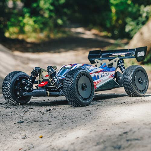 RC car on a dirt path in an outdoor setting.