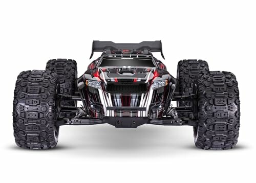Front view of a black and red RC monster truck with large tires.