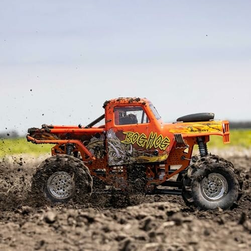RC monster truck driving through mud