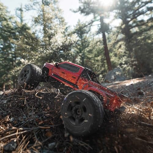 Red RC truck navigating forest terrain