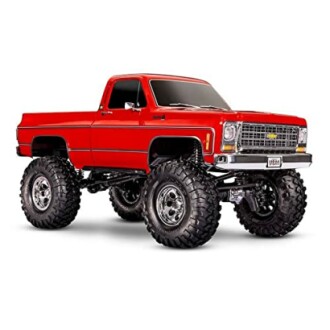 Red monster truck with large tires and chrome details